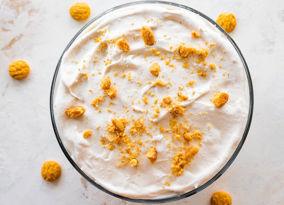 The top of a healthy banana pudding topped with crushed vanilla wafers.